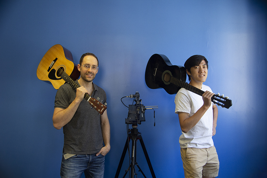Mark Sheinin (left) and Dorian Chan were part of a CMU research team that developed a camera system that can see sound vibrations with such precision that it can capture isolated audio of separate guitars playing at the same time.