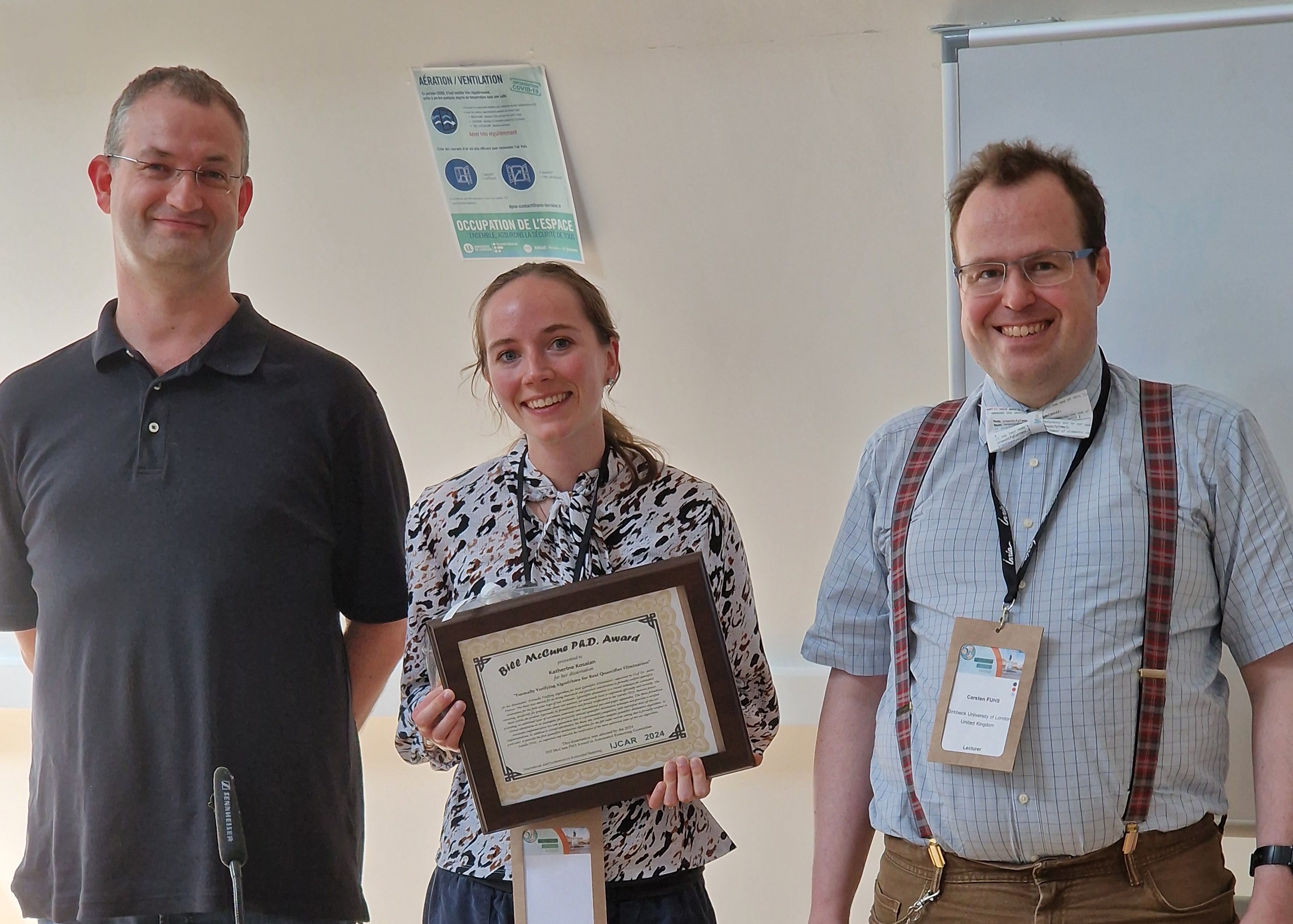 André Platzer, Katherine Kosaian (holding award plaque), and Carsten Fuhs (Photo: Jürgen Giesl)