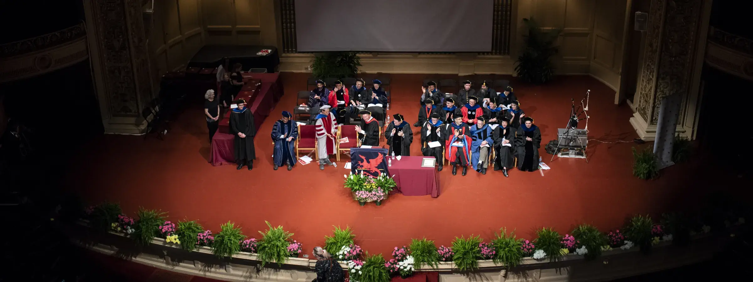SCS Faculty on stage at the Carnegie during commencement