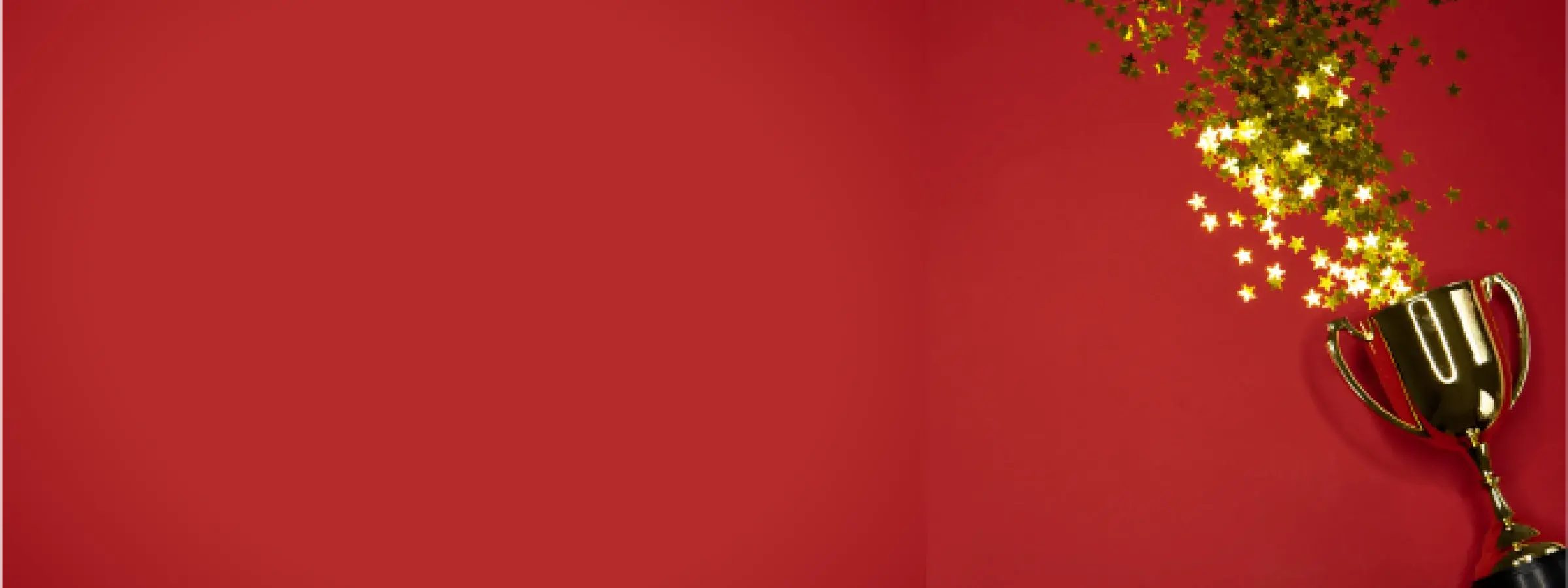 award trophy with star confetti on a red background